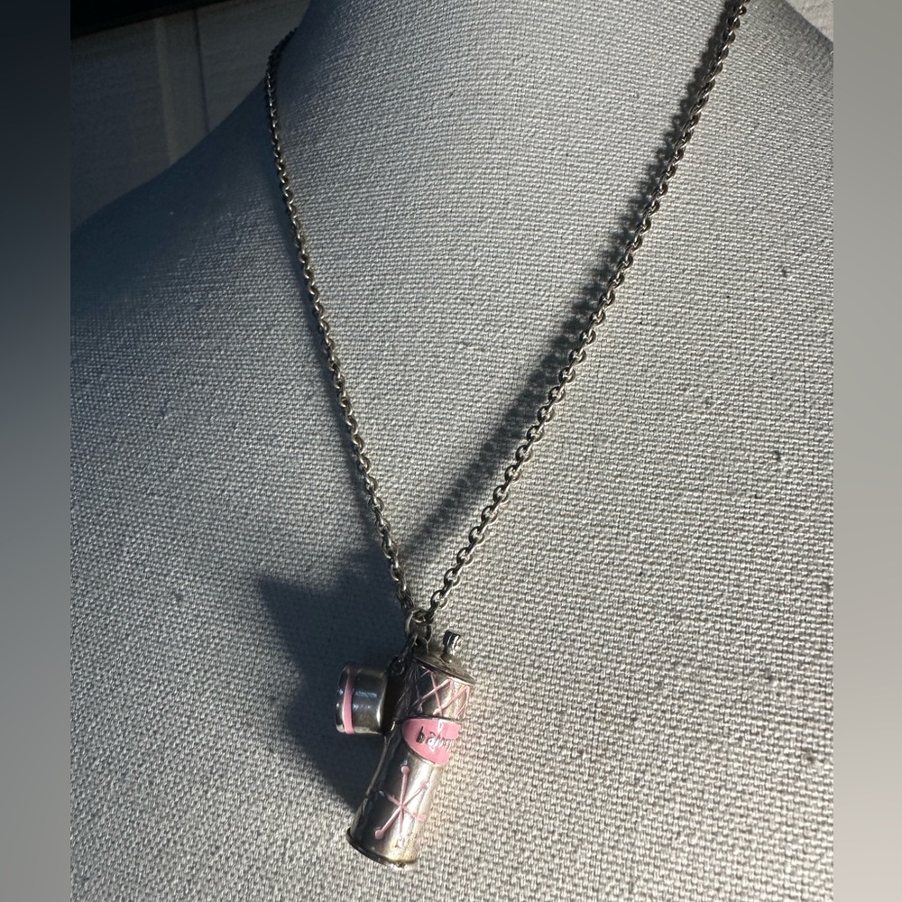 Older silvertone charm Hairspray can necklace